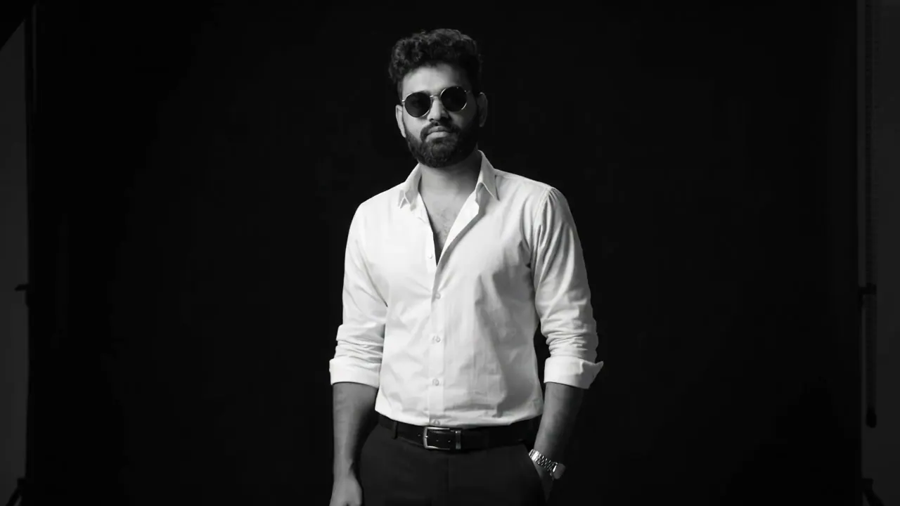 Sudip KC, full-stack developer and UI/UX designer, in a black-and-white studio portrait